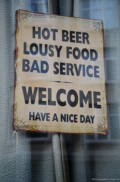 397px-Hot_beer,_lousy_food,_bad_service_-_Welcome,_have_a_nice_day_sign_in_Antwerp,_Belgium